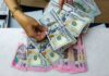Rupiah Makin Lemah, Tembus Rp18.100 per Dolar